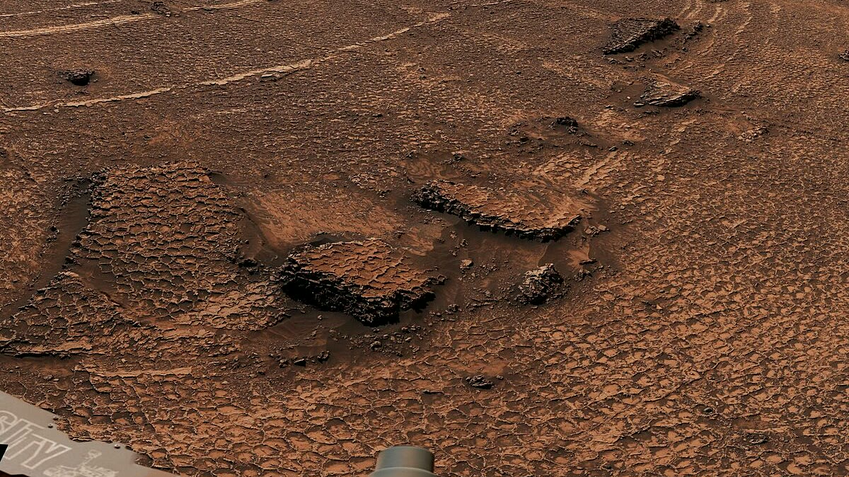 Imagen conceptual de la superficie de Marte mostrando el tipo de terreno volcánico del que pudo provenir el meteorito NWA 13441